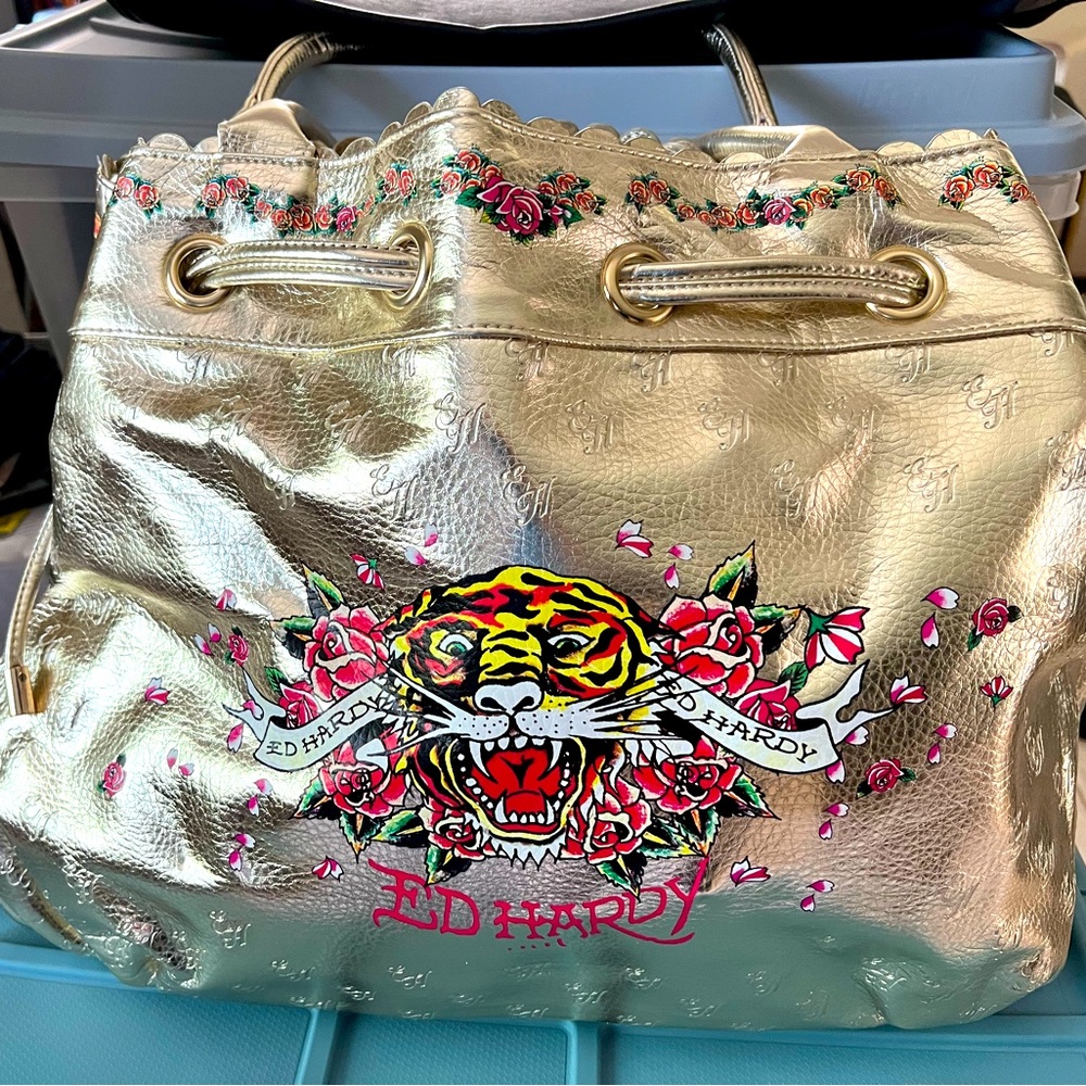 Ed Hardy , Gold leather brand new 19x14 inches